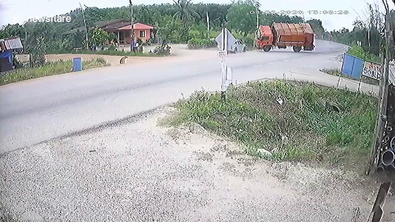 Thai motorcyclist miraculously survives after dustbin lorry falls onto him