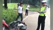 Indonesian motorcyclist throws tantrum after being ticketed