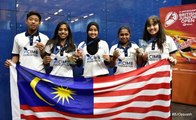 Victorious junior squash team return home from Britain