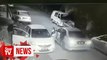 CCTV captures armed men with machete robbing Grab driver