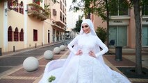 Bride poses for wedding pictures as Beirut explosion happens