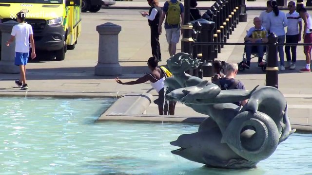 Londoners cool off at Trafalgar Square fountains on 'Furnace Friday'