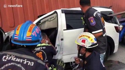 Container truck falls on two cars but families miraculously survive