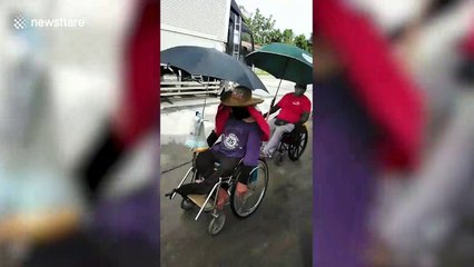 Wheelchair users travel more than 100 miles home during new Covid-19 lockdown in the Philippines