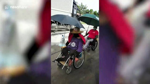Wheelchair users travel more than 100 miles home during new Covid-19 lockdown in the Philippines