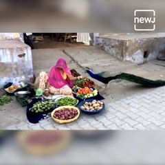 A Vegetable Seller Shows Her Kindness By Feeding The Peacock