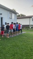 Man And His Sons Do Hopscotch Dance in Queue