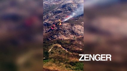 Aerial firefighting plane burns on mountaintop in Spain