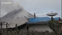 Indonesian villagers clear volcanic ash day after Mount Sinabung eruption