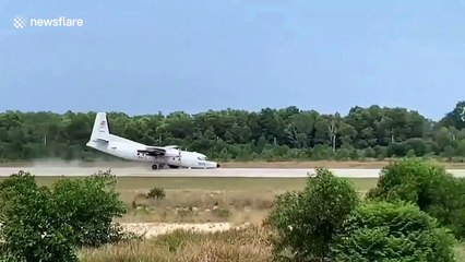 Download Video: Military plane crash lands by skidding along nose after front wheel fails