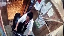 Scooter bursts into flames after Chinese woman pushes it into elevator