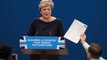 Prankster and coughing fit mar Theresa May's speech