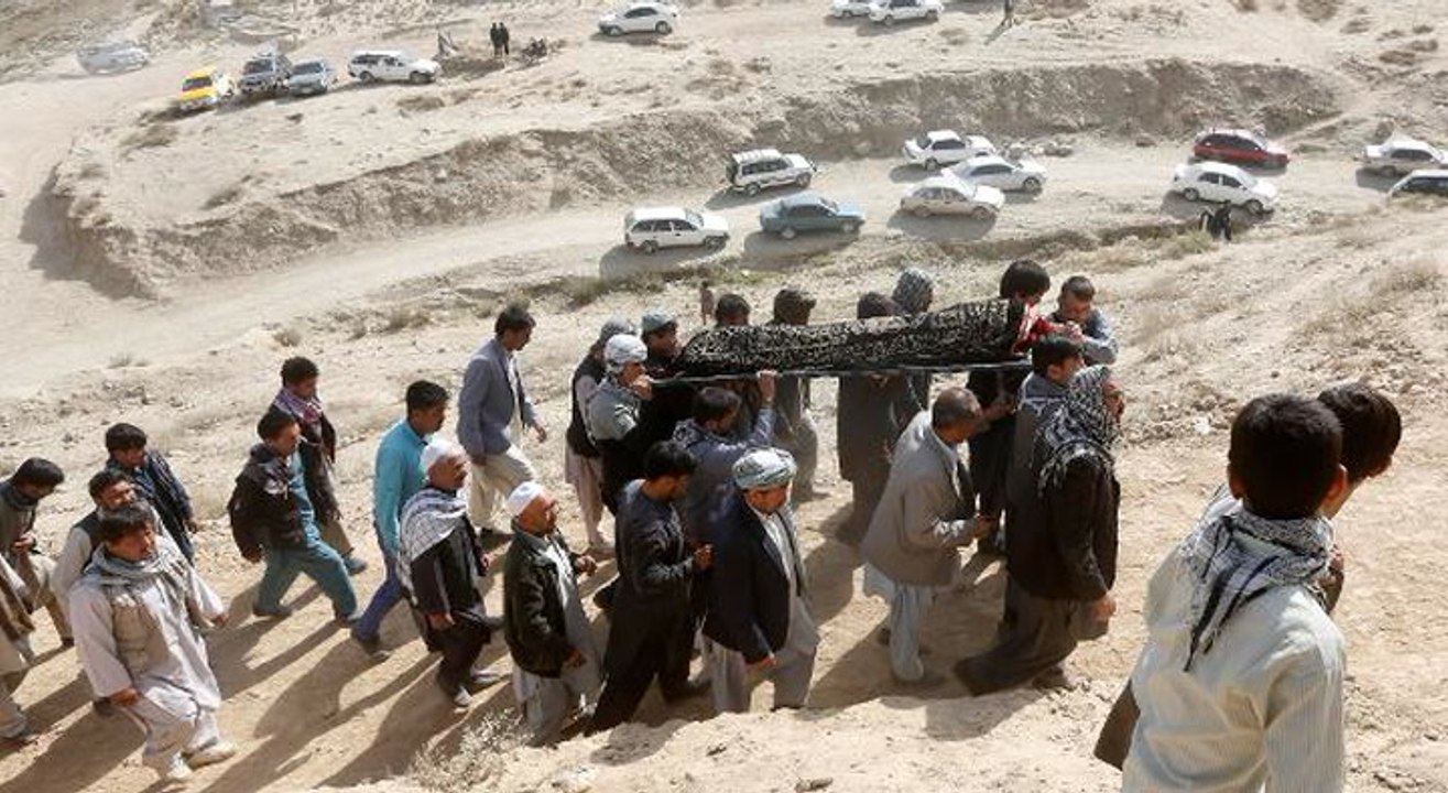 Afghans hold funeral prayers for Muslims killed...