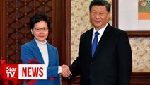 China's Xi gives Hong Kong leader his full support