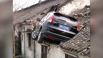 Car lands on house roof in China