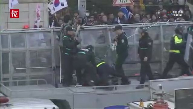 Park’s impeachment sparks protest; two die