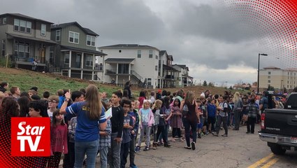 Two students open fire at Colorado school, killing one, wounding eight