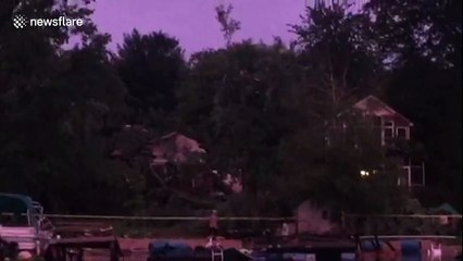 Snapped trees, sunken boats and damaged houses as storm front leaves trail of destruction in its wake