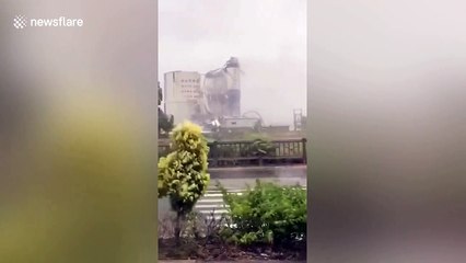 Typhoon Mekkhala rips off cement container's metal cover at Chinese factory