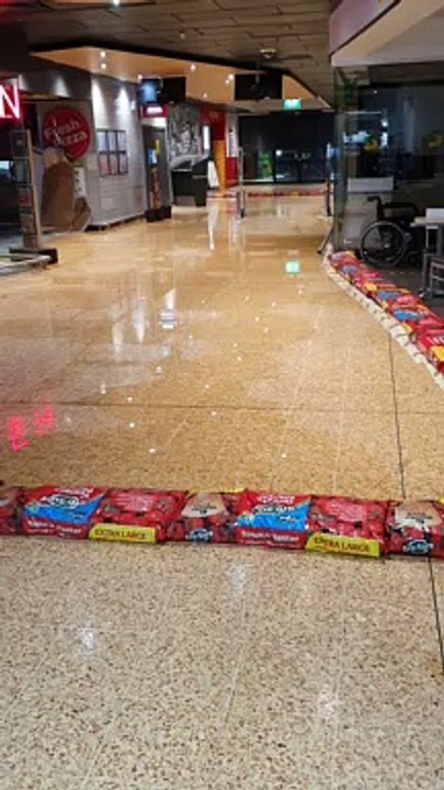 Watch as rain pours in through Edinburgh Asda c...