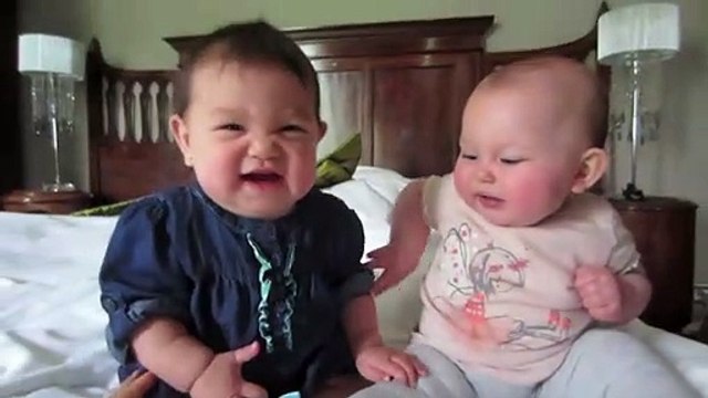 Cute babies talking with each other