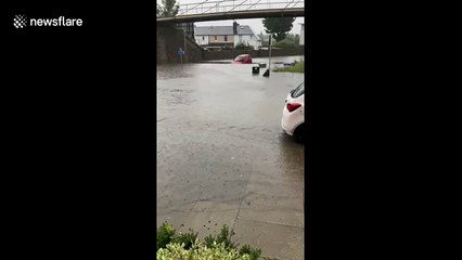 Bizarre moment 2 cars in Scotland float on flooded road