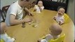 Cute quadruplets laughing with father