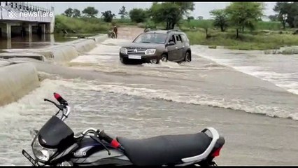 Car carrying four people rescued by villagers from heavy flow of water in India