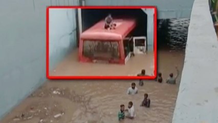 Gujarat: Bus rescued after stuck under a waterlogged bridge