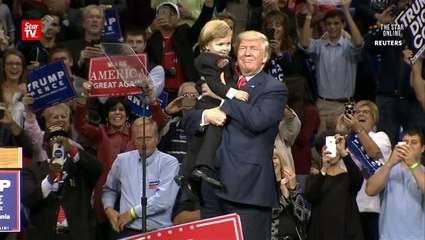 Trump brings toddler lookalike on stage