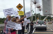 Activist Siti Kasim protests hudud bill outside Parliament