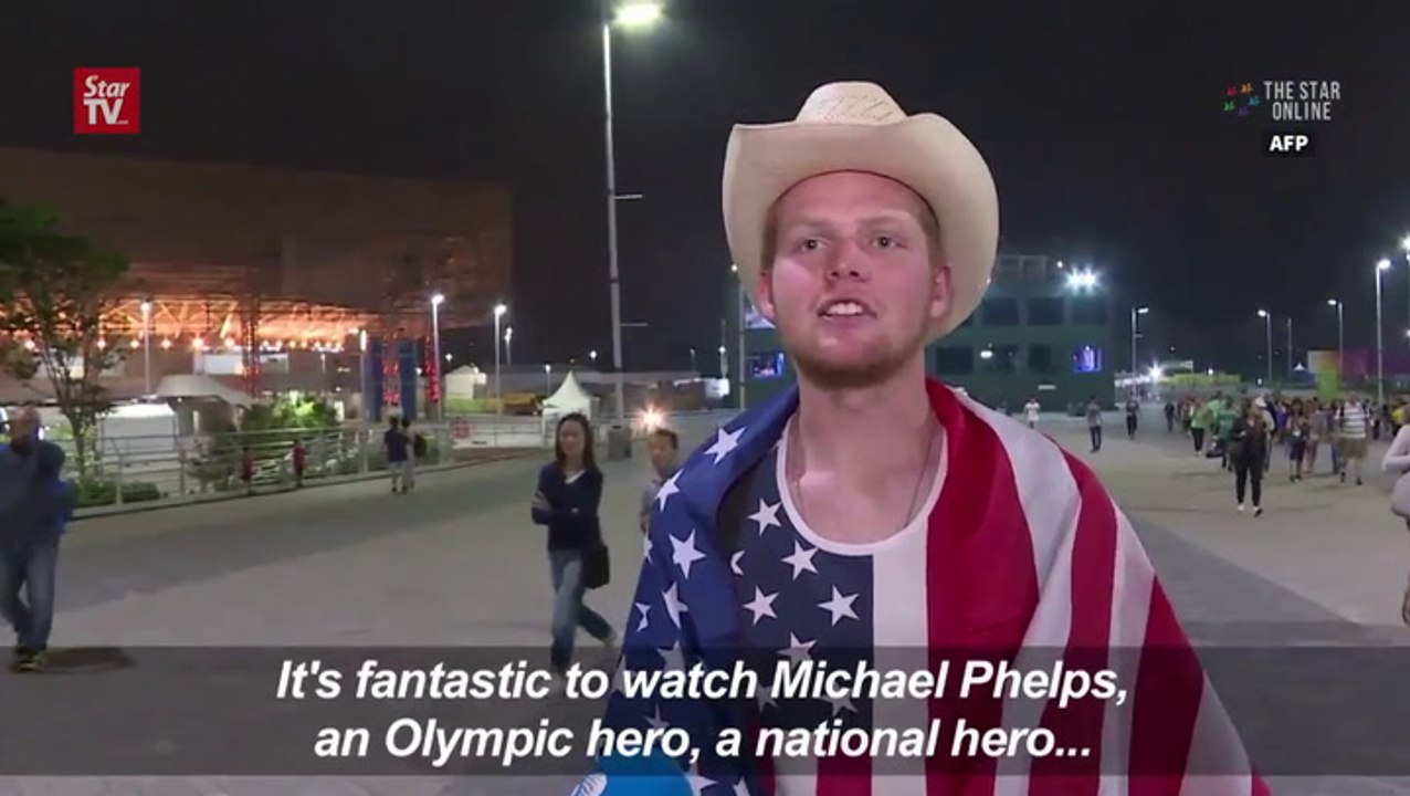 Phelps delights fans with record 21st Olympic gold