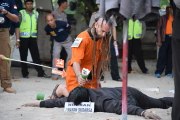Australian woman, British man re-enact Indonesian cop's death