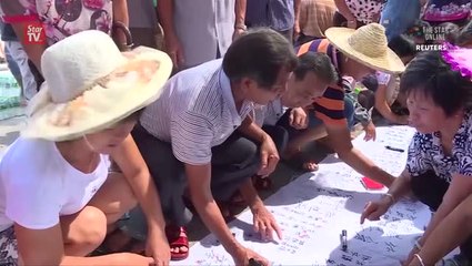 Chinese official threatens to hit journalists