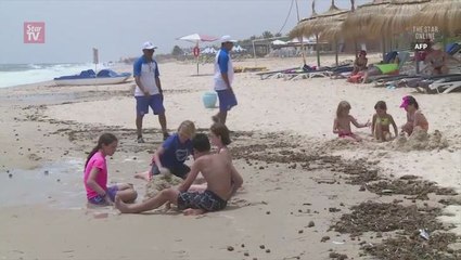 Tunisia flaunts seaside security year after beach massacre