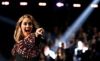 Adele rules Grammys despite slip up