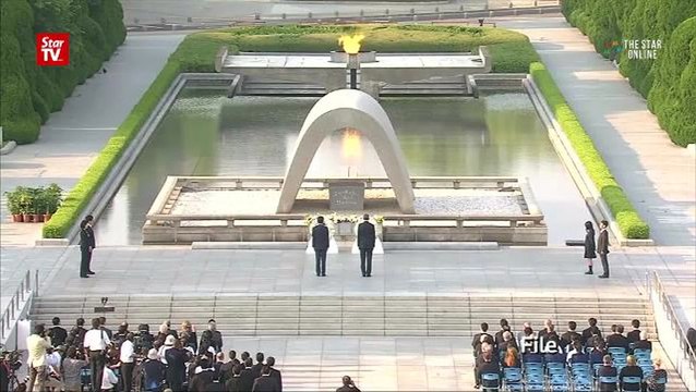Japan's Abe pays respects at Hawaii memorials