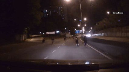 Dashboard camera shows cyclists endangering themselves