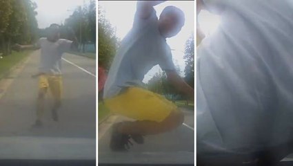 Man caught on video hurling himself onto car in Singapore