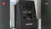 ATM vandalised by hammer-wielding man
