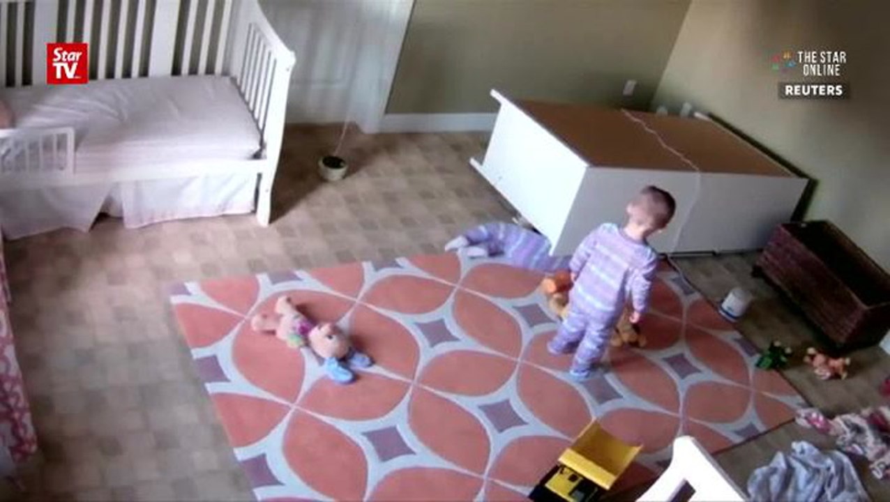 Two-year-old saves twin brother after furniture...