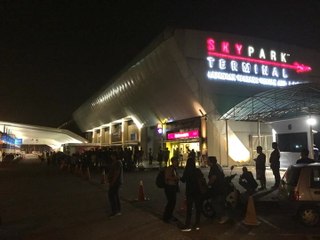 Scores of people wait for ex-PM and wife at Subang airport