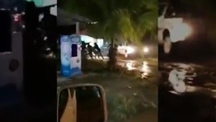 Woman shot after husband rams police car at road block