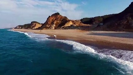 Couple taking a walk at the shore beach