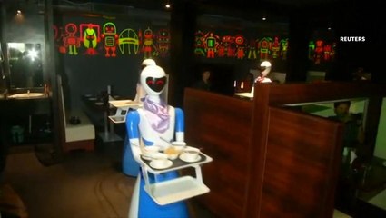 Robots serve customers at Indian restaurant