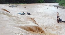 Villagers rescue four from car trapped in flash floods in Sabah