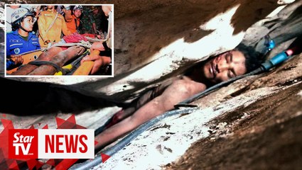 Cambodian rescued after four days wedged between rocks in a cave