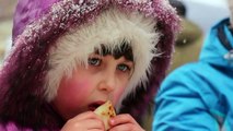 Eskimo little girl eating pancakes