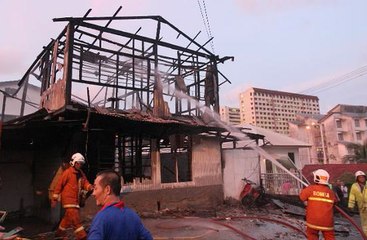 Gardener dead after running back into burning house