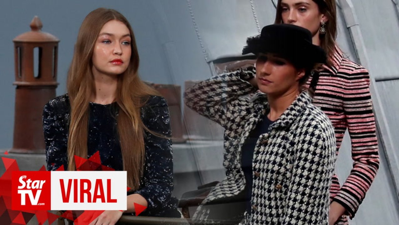 Gigi Hadid stops Chanel catwalk crasher at Paris Fashion Week